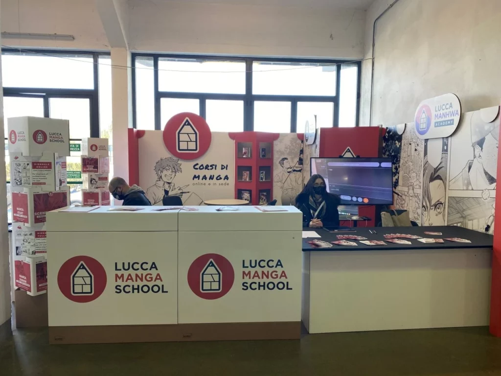 Cardboard fair stand for Lucca Manga School - event set-up and stand